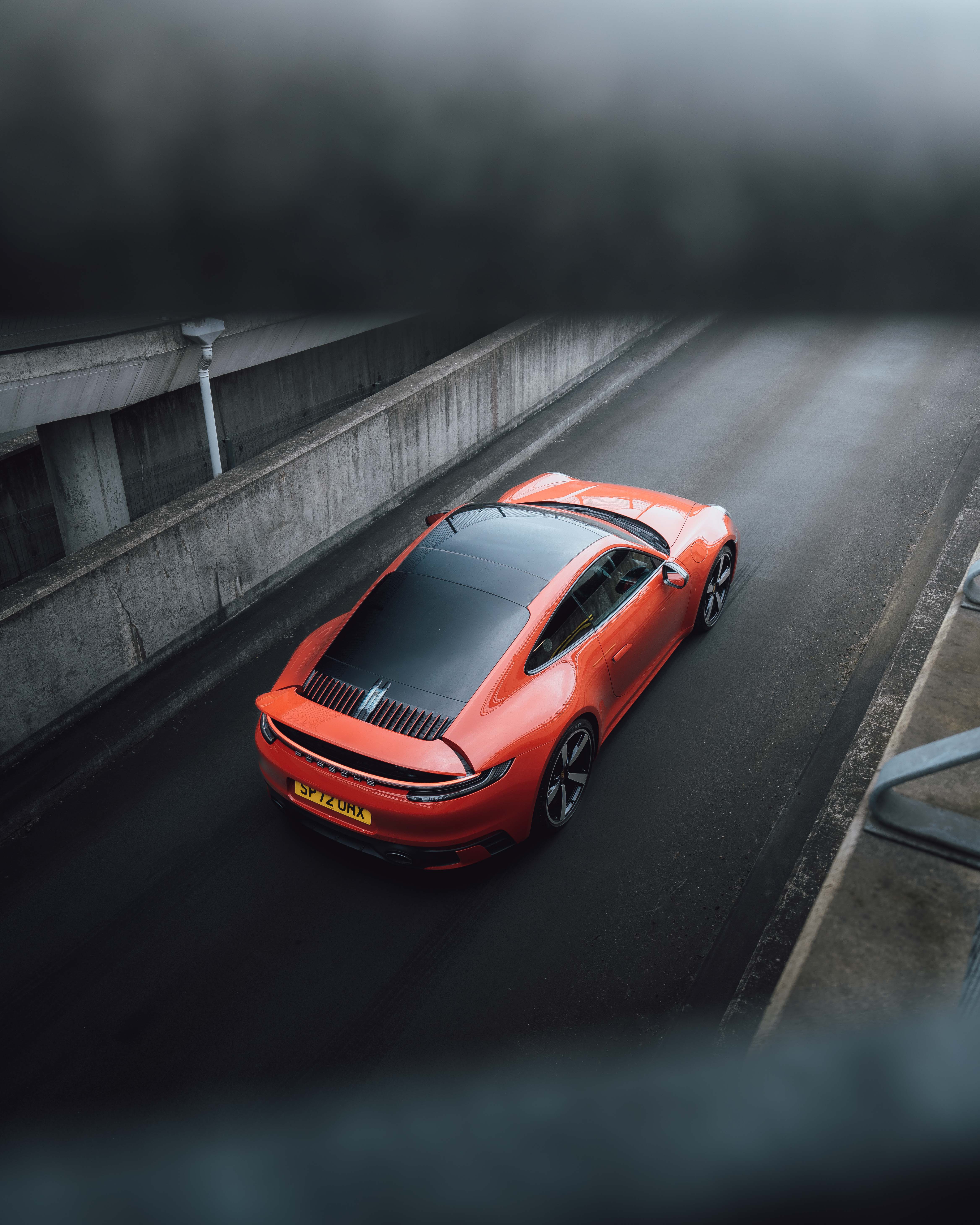 Aerial shot of an orange Porsche